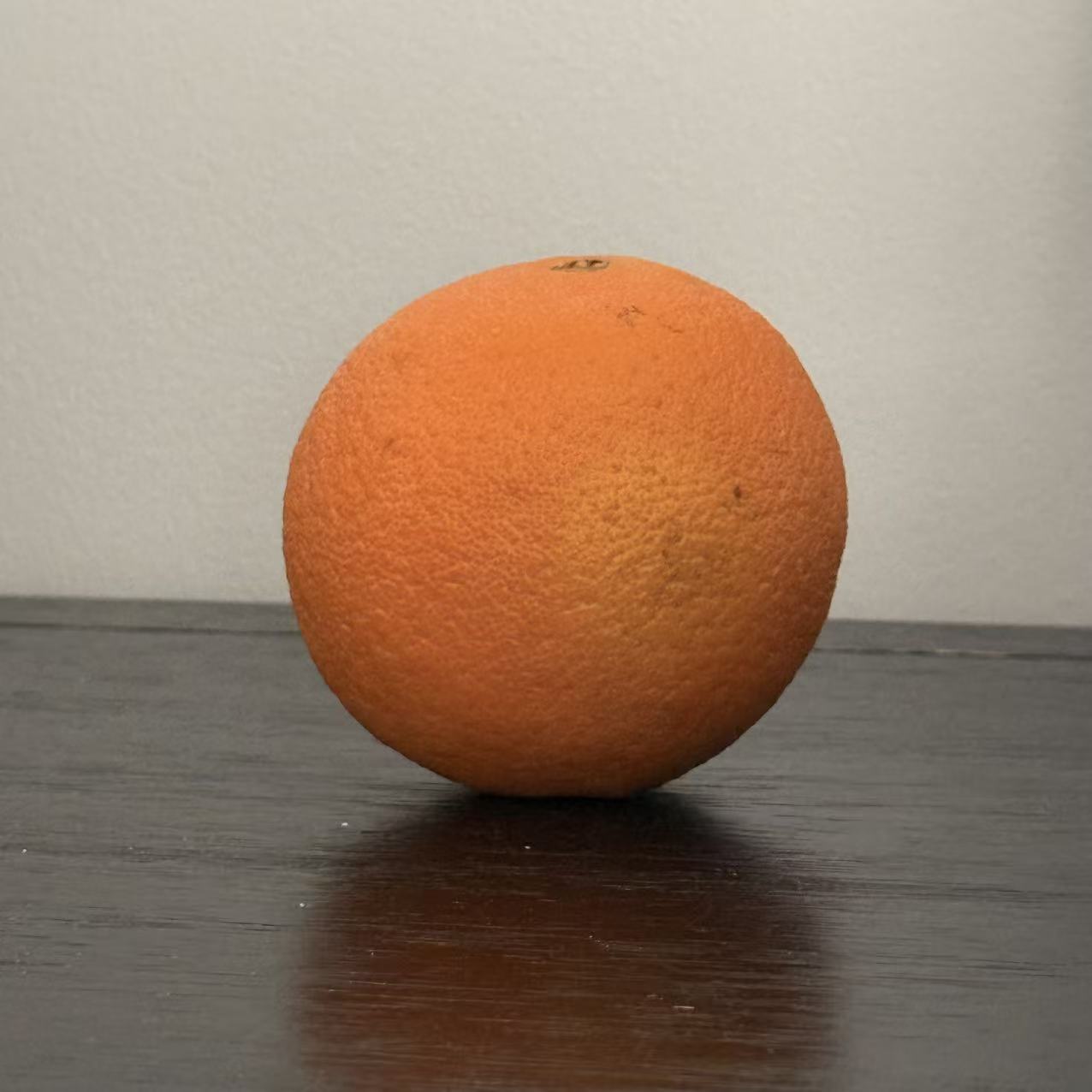 This is an orange I photographed. I chose it because its texture is very challenging to design.